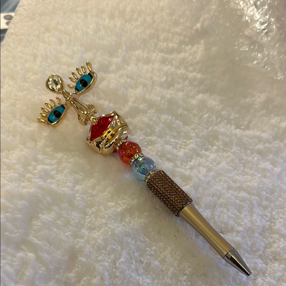 Gold and Red Eye Pendant